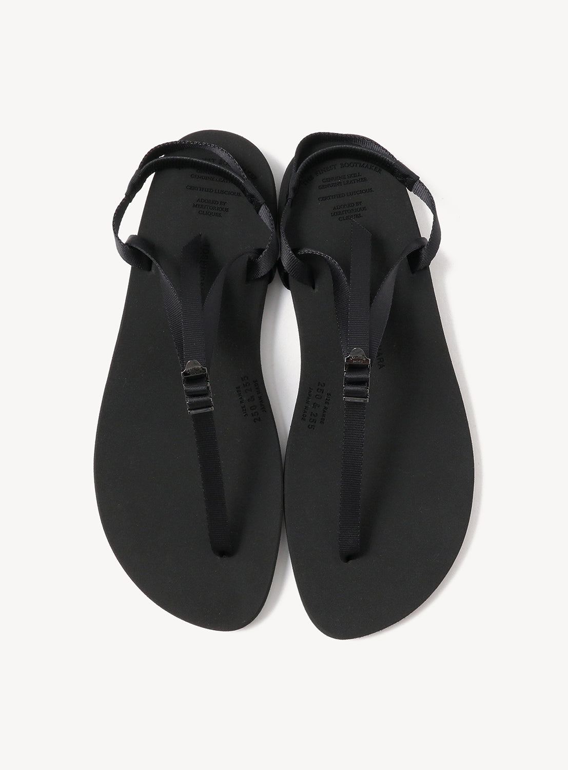 A pair of BEAUTIFUL SHOES Minimalist Huarache Barefoot Sandals in black, designed with thin straps and a subtle huarache-inspired style, are photographed from above on a white background.