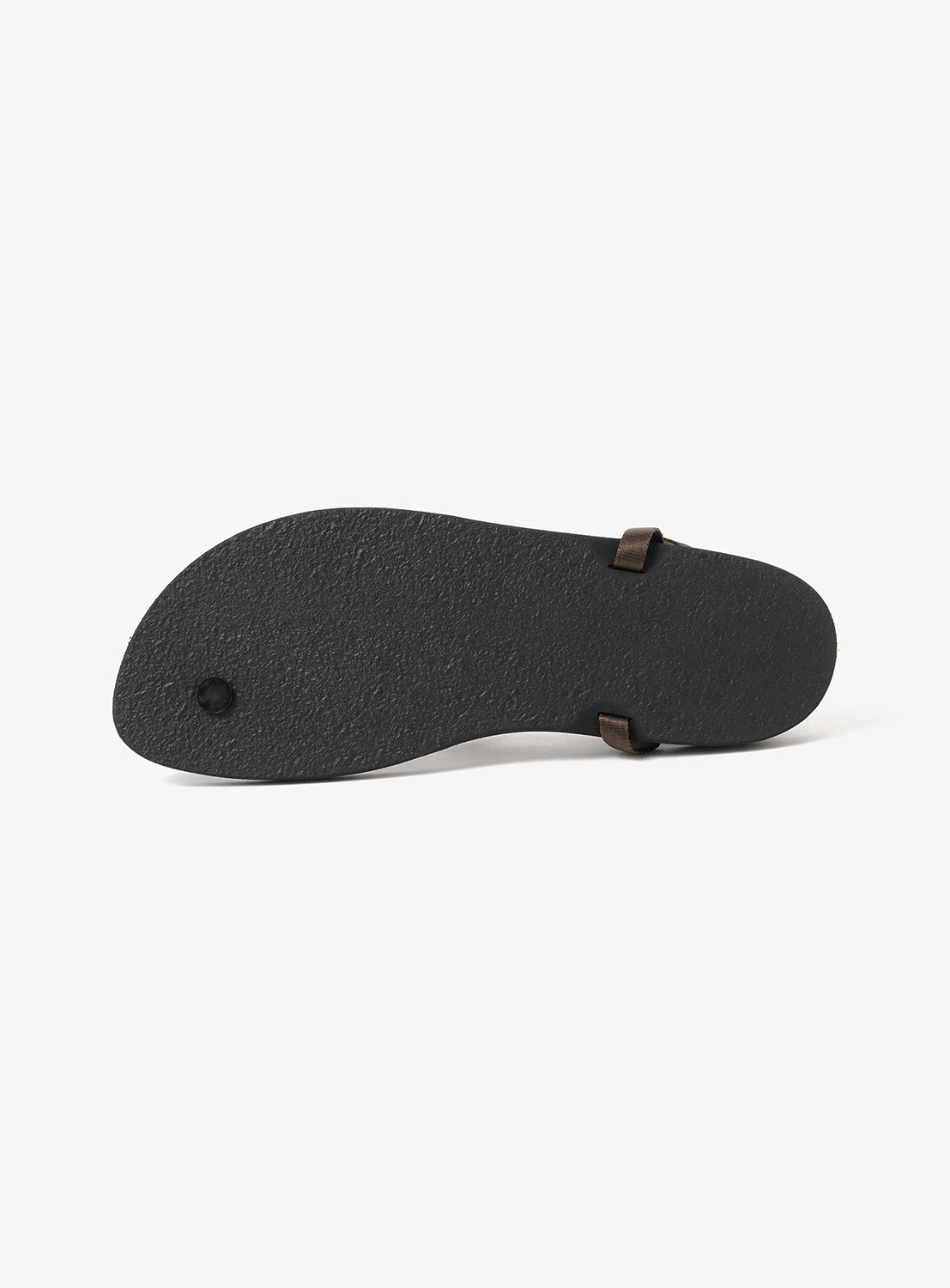 The image displays the bottom view of the BEAUTIFUL SHOES Minimalist Huarache Barefoot Sandals, featuring a black textured sole and two visible brown side straps, highlighting the signature minimalist silhouette characteristic of Huarache sandals.