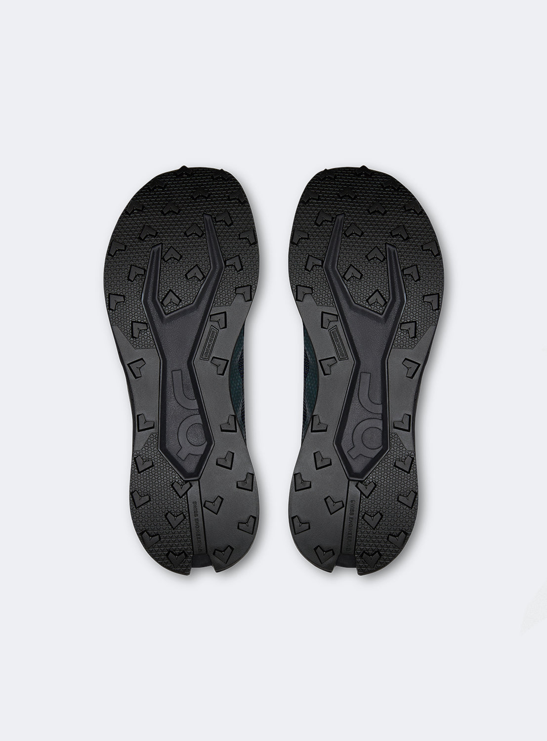 Sole of an iron black running shoes with blue and dark purple details. 
