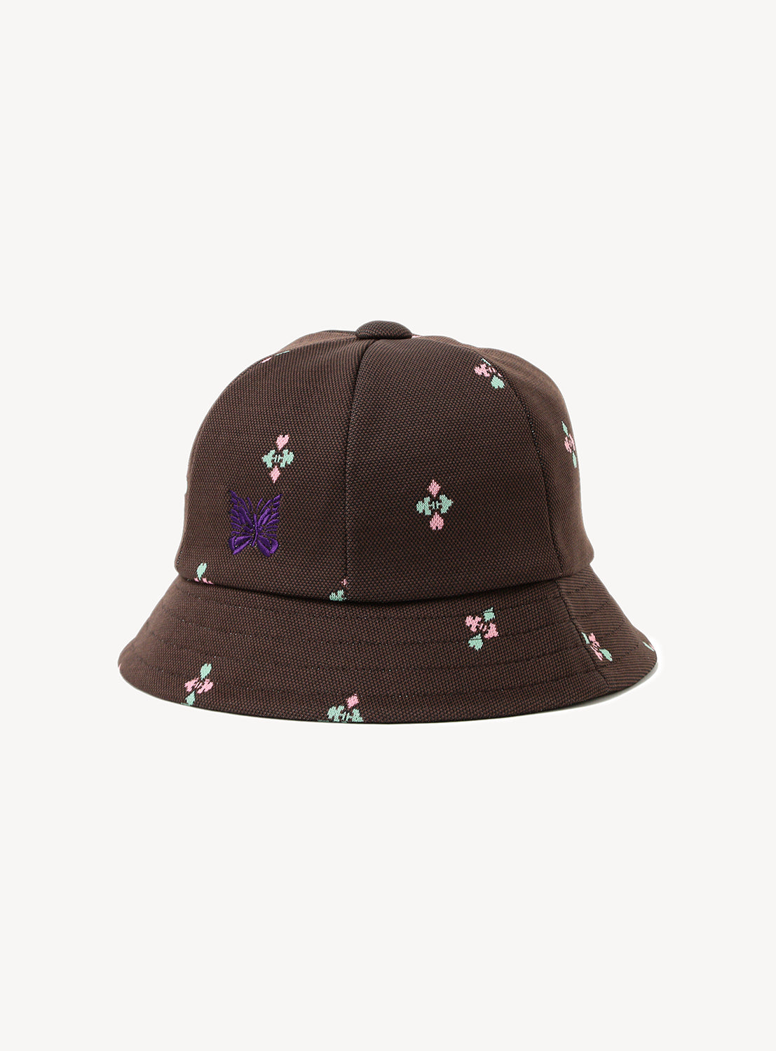 Brown bucket hat with pink and mint designs with a purple embroidered butterfly. 