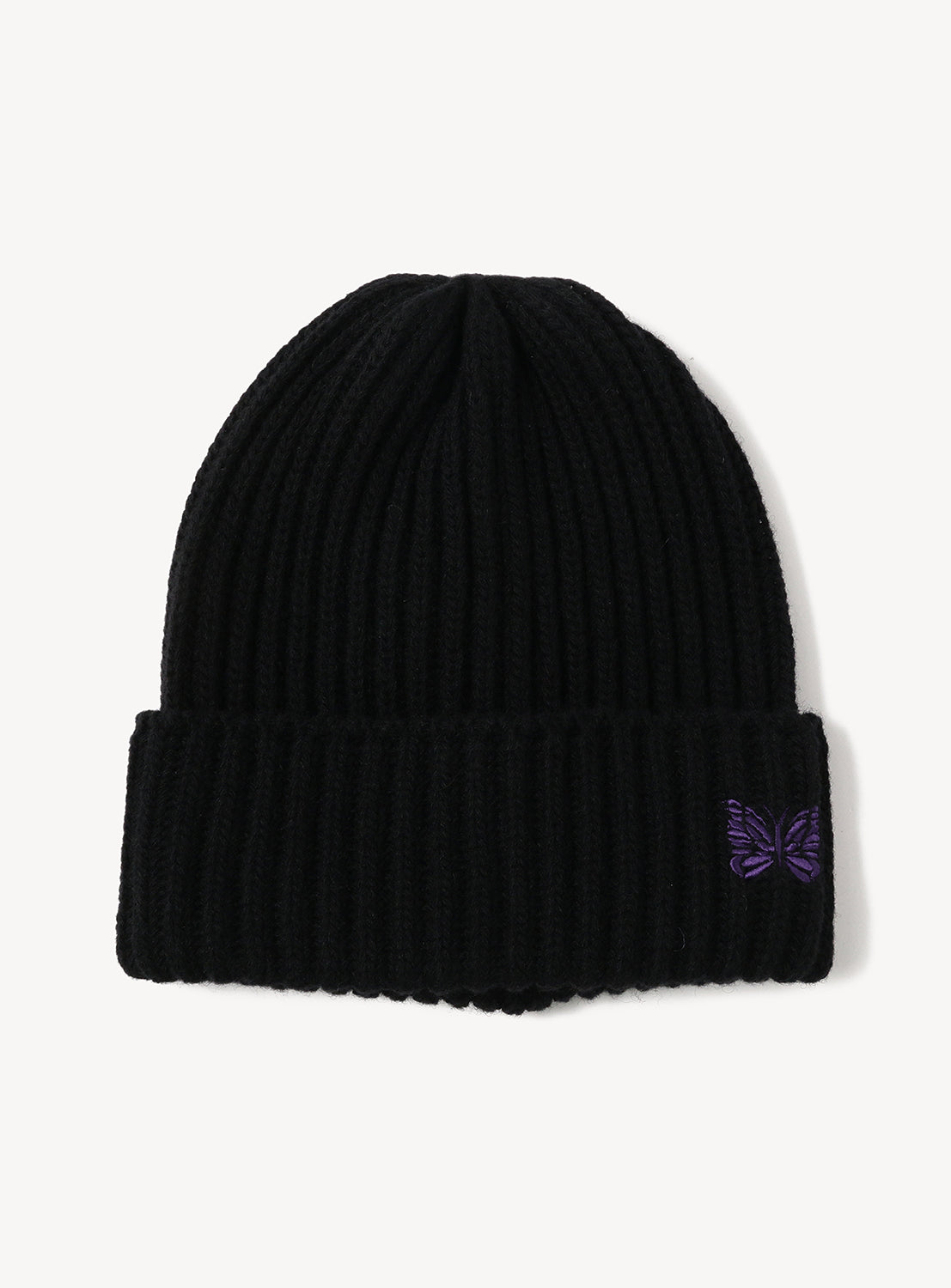 Black ribbed NEEDLES Shetland Wool Watch Cap, a lightweight, warm beanie featuring a small purple butterfly embroidery on the cuff.