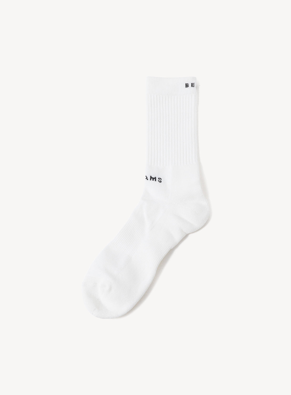 White New Basic Socks by BEAMS featuring black logo text on the ribbed cuff and ankle.