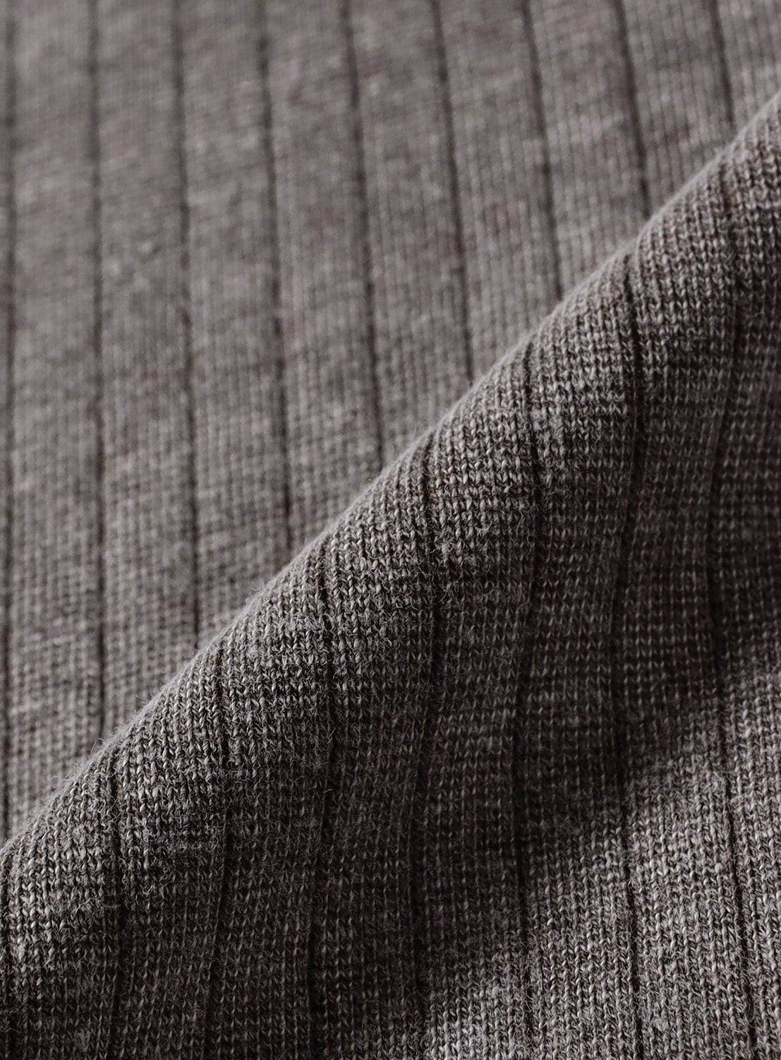 Close-up of a brown Vintage-Look Faded Stretch Rib T-Shirt in a stretch pique rib knit fabric with a folded corner.