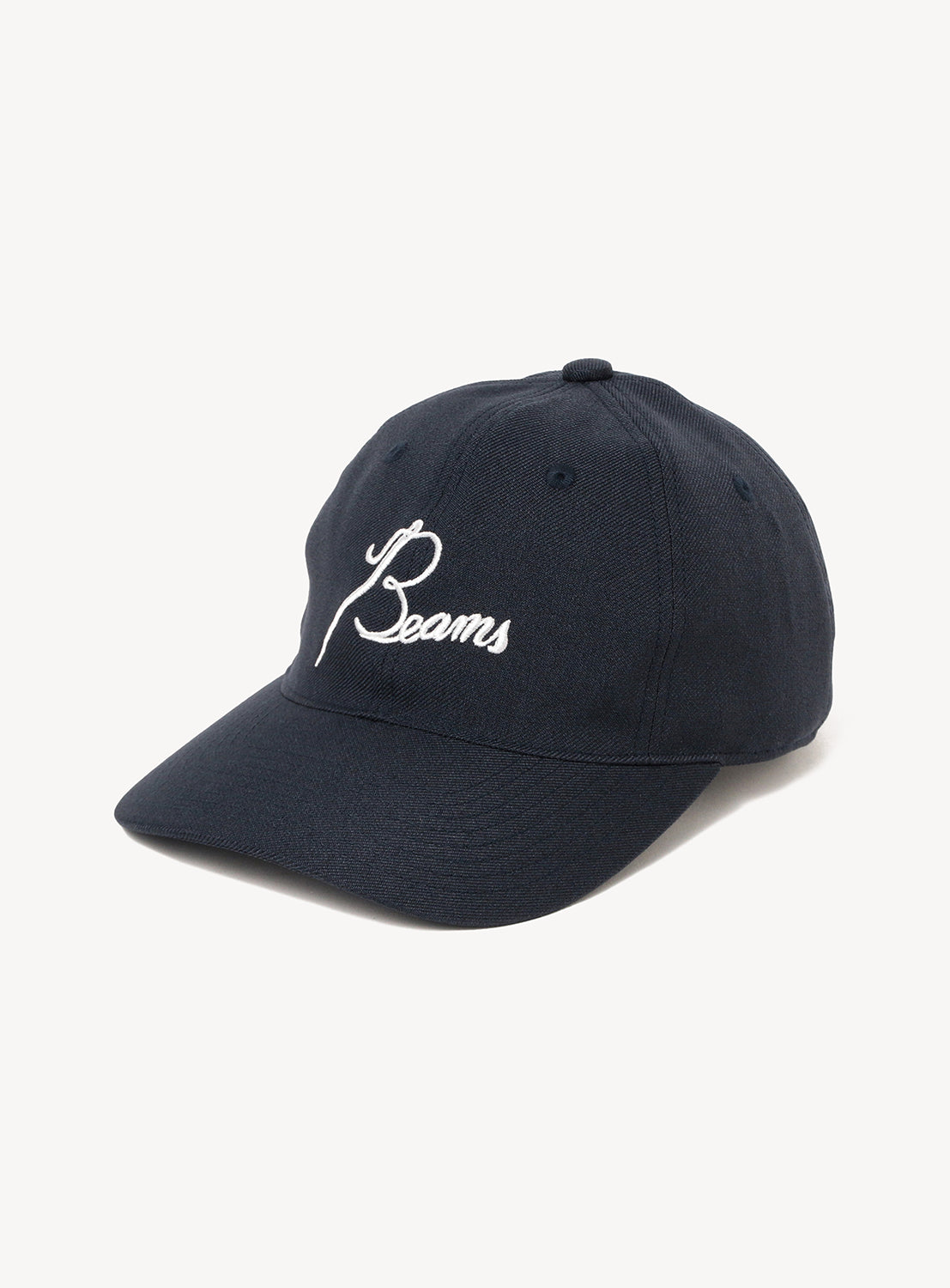 An [Exclusive] Needles 50th Baseball Cap by NEEDLES, featuring dark navy fabric and white custom “Beams” embroidery on the front, from a special collaboration, photographed against a plain white background.