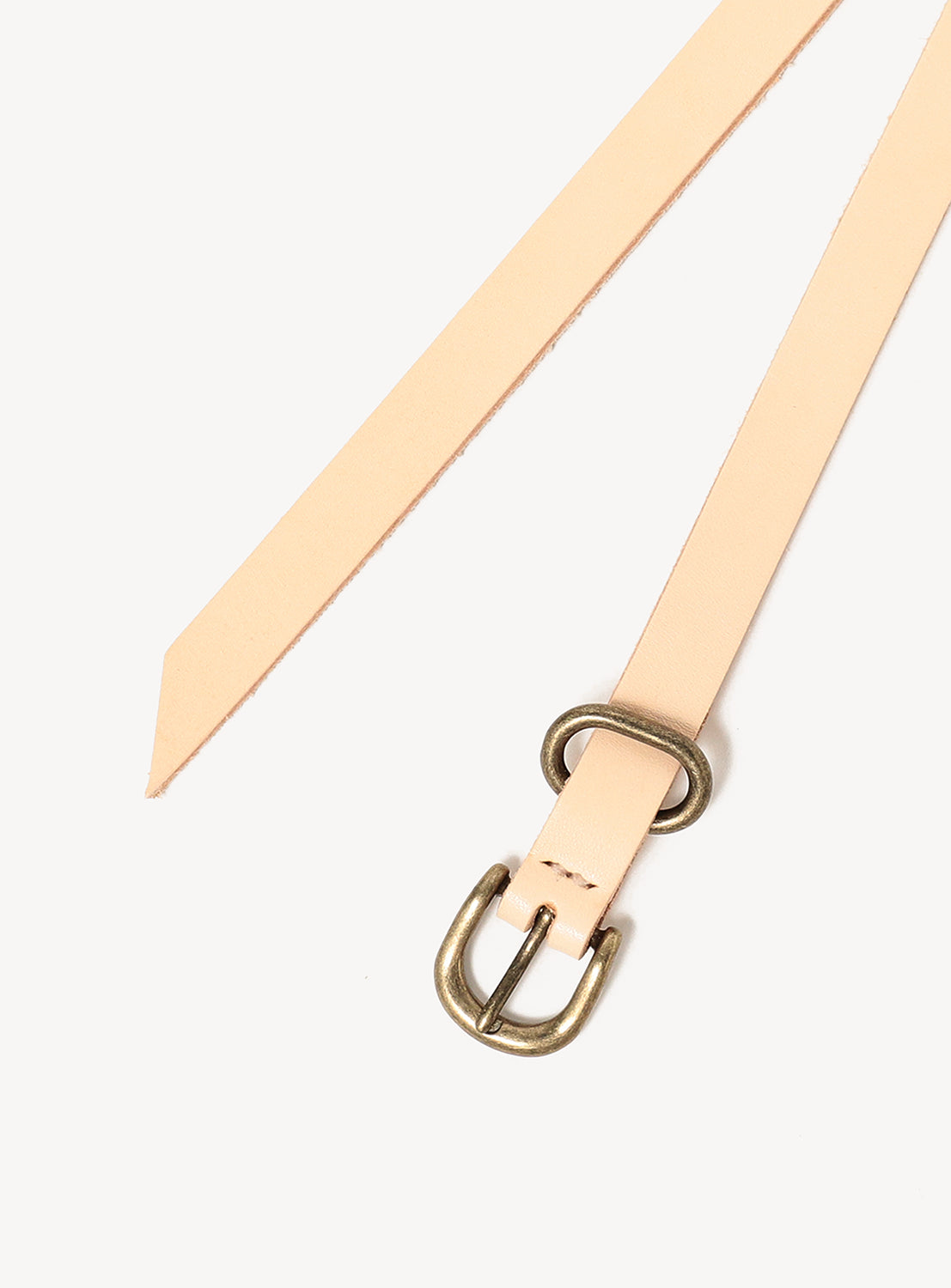 Hender Scheme Extended Belt in long, light-colored vegetable-tanned cow leather with a brass-toned metal buckle and loop.