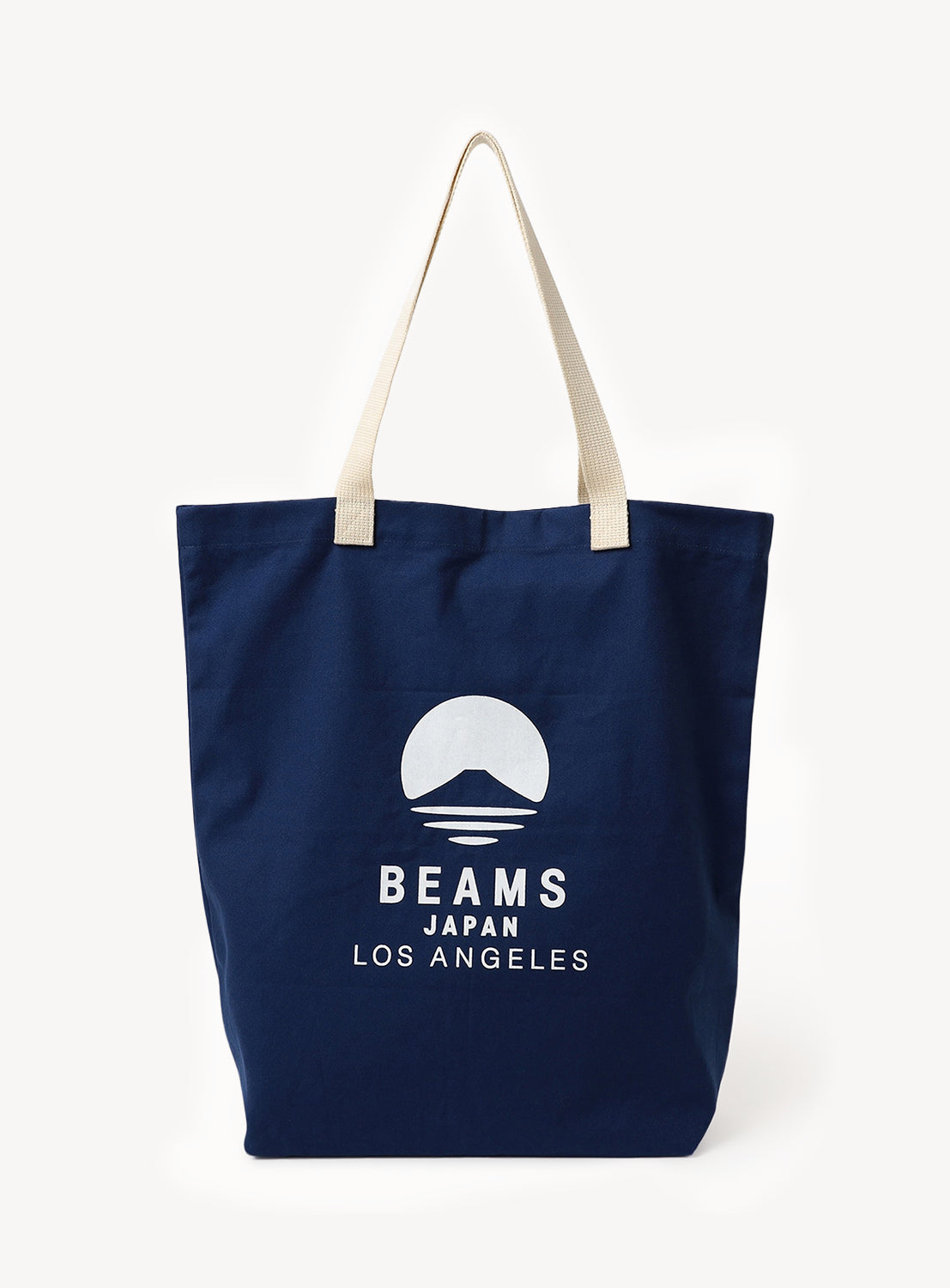 Introducing the [Exclusive] BEAMS JAPAN LA Tote Bag by BEAMS JAPAN—a stylish and durable navy blue canvas tote featuring beige handles. The front is adorned with a white graphic of a mountain and sun, alongside the bold text “BEAMS JAPAN LOS ANGELES” in all caps. Photographed against a white background, this limited-edition tote perfectly blends form and function.