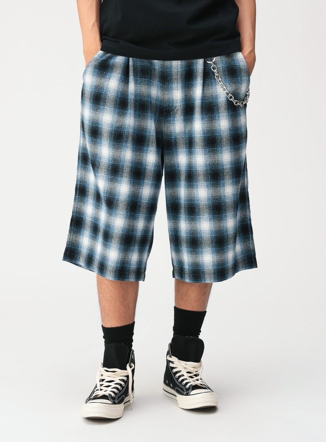 BEAMS Check Shorts in blue, white, and black with a wide-leg, relaxed fit, an adjustable waist, and a silver chain attached to the waistband.