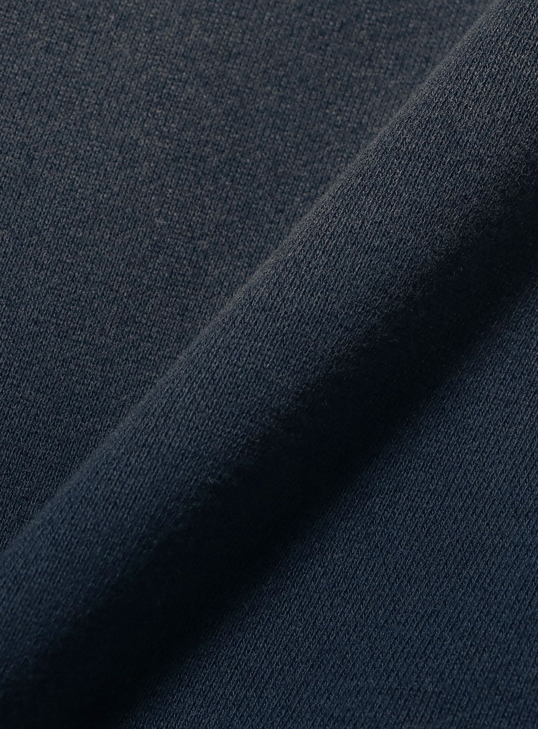 Close-up of dark blue fabric with a subtle texture