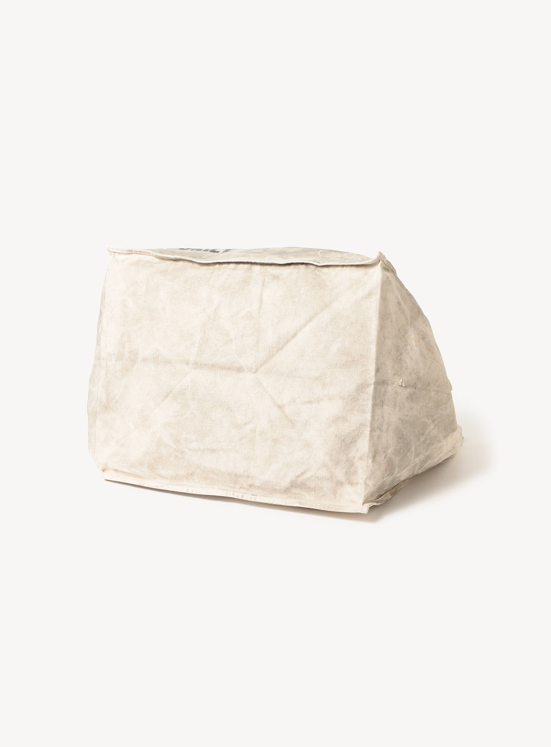 Bottom of the white canvas tote bag.