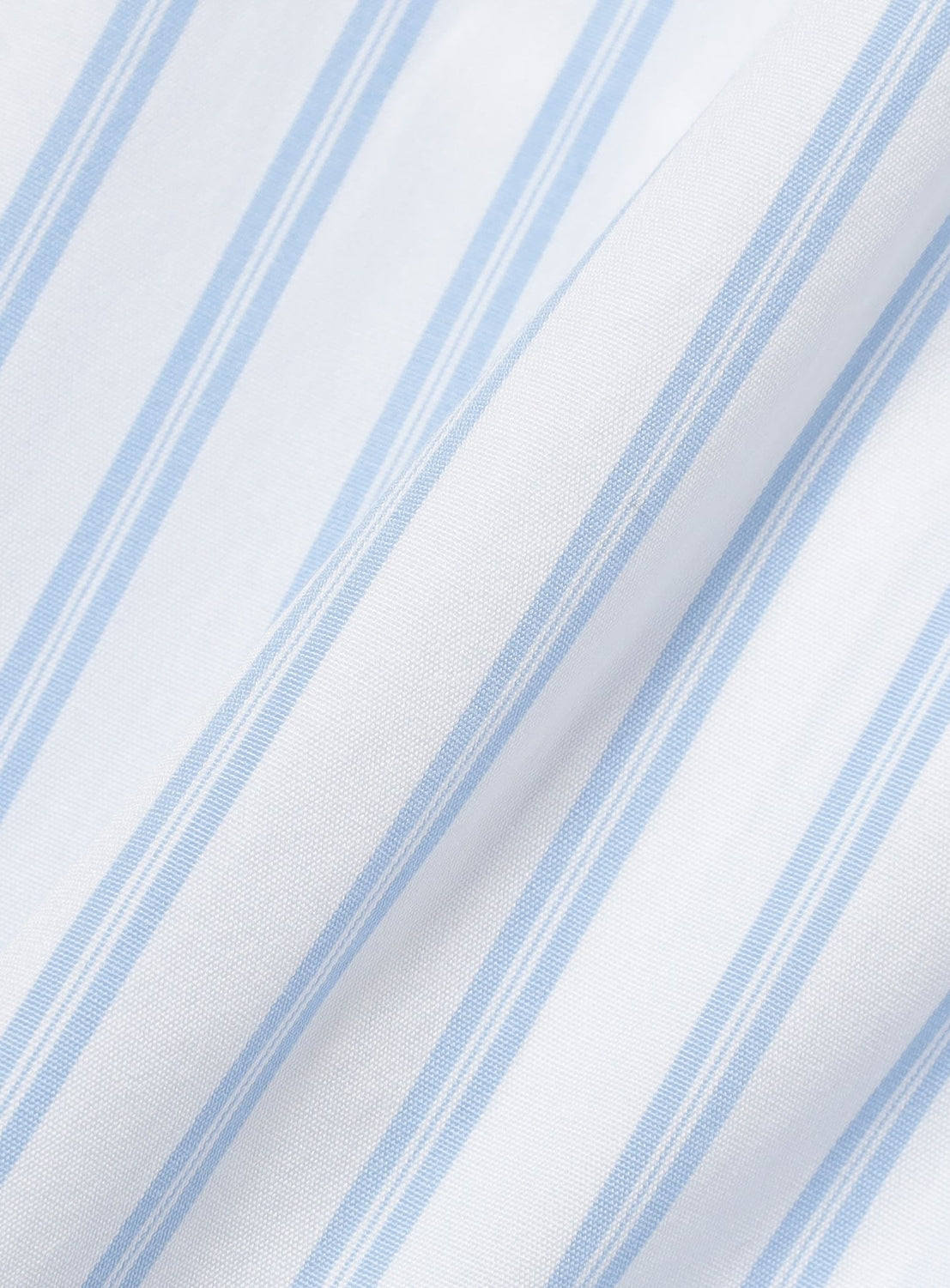 Light blue and white vertical striped fabric of a BEAMS Striped Zip-Up Shirt, shown with folds.
