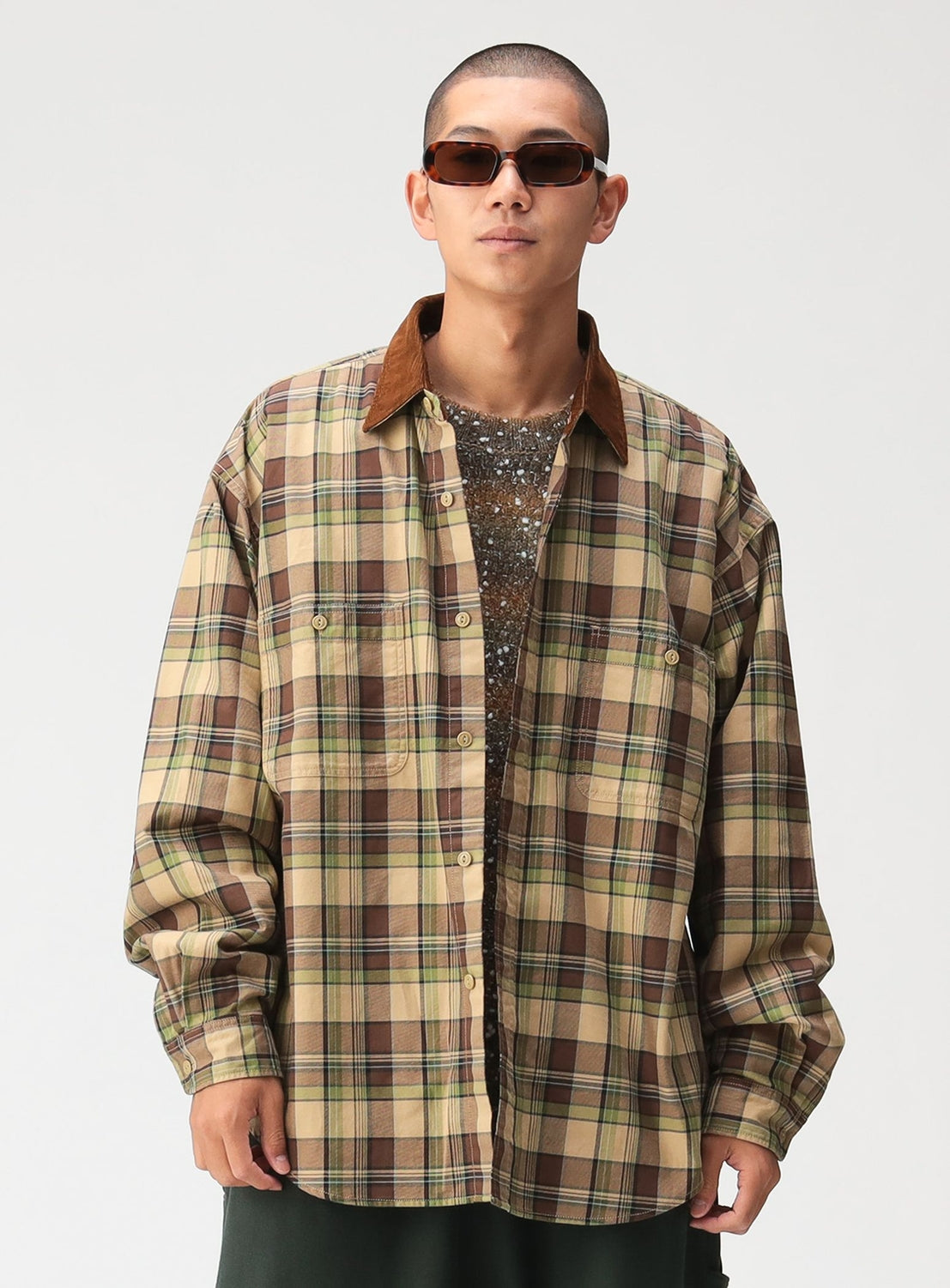 Person wearing a BEAMS Classic Check Work Shirt in brown and green with a contrasting brown corduroy collar and rectangular sunglasses.