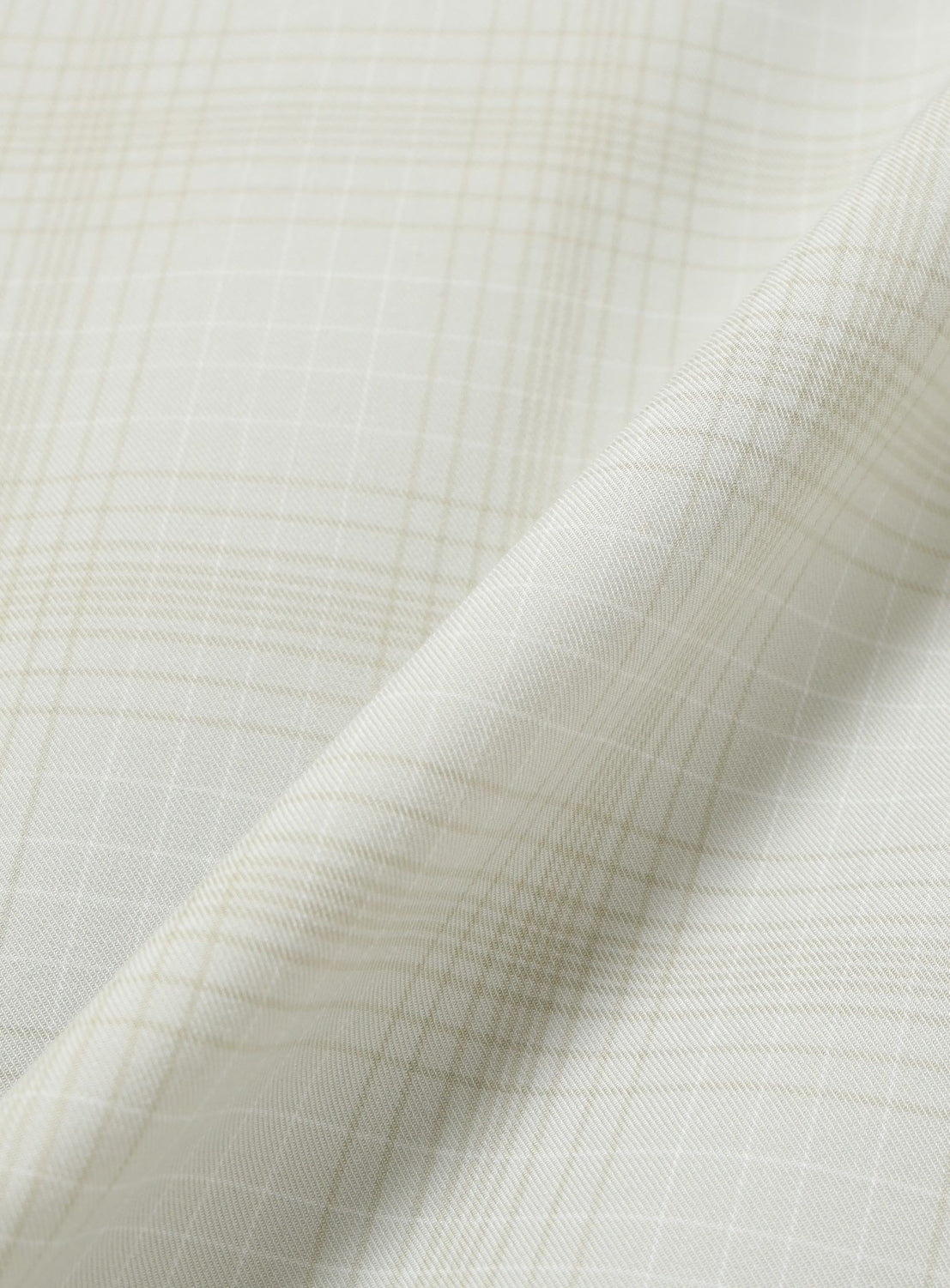 Close-up of the light beige BEAMS Shadow Check Shirt fabric with a subtle white grid pattern.