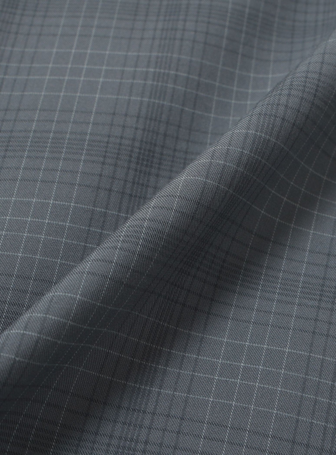 Close-up of a wide-fit grey BEAMS Shadow Check Shirt featuring a subtle tonal check pattern.