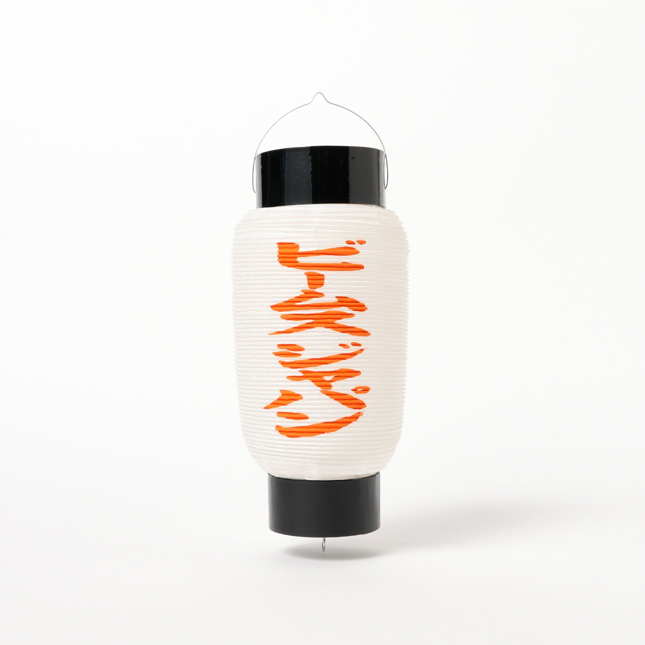 The [Exclusive] Nakakichi-Style Paper Lantern by AKIMURATAIHEIDO x BEAMS JAPAN, featuring a white paper body with black top and bottom accents and vibrant orange Japanese katakana characters on the front reminiscent of a classic Chochin lantern, hangs against a plain white background.
