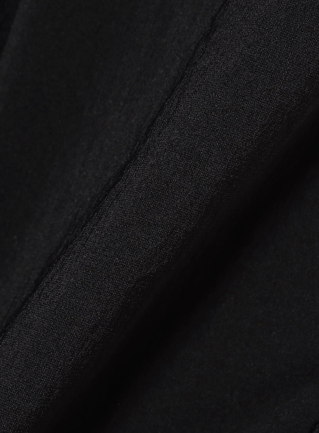 Close-up of TEATORA’s Wallet Shorts Resort - Doctoroid in black, highlighting the breathable performance fabric's subtle texture and diagonal fold—perfect for quick-drying travel shorts.