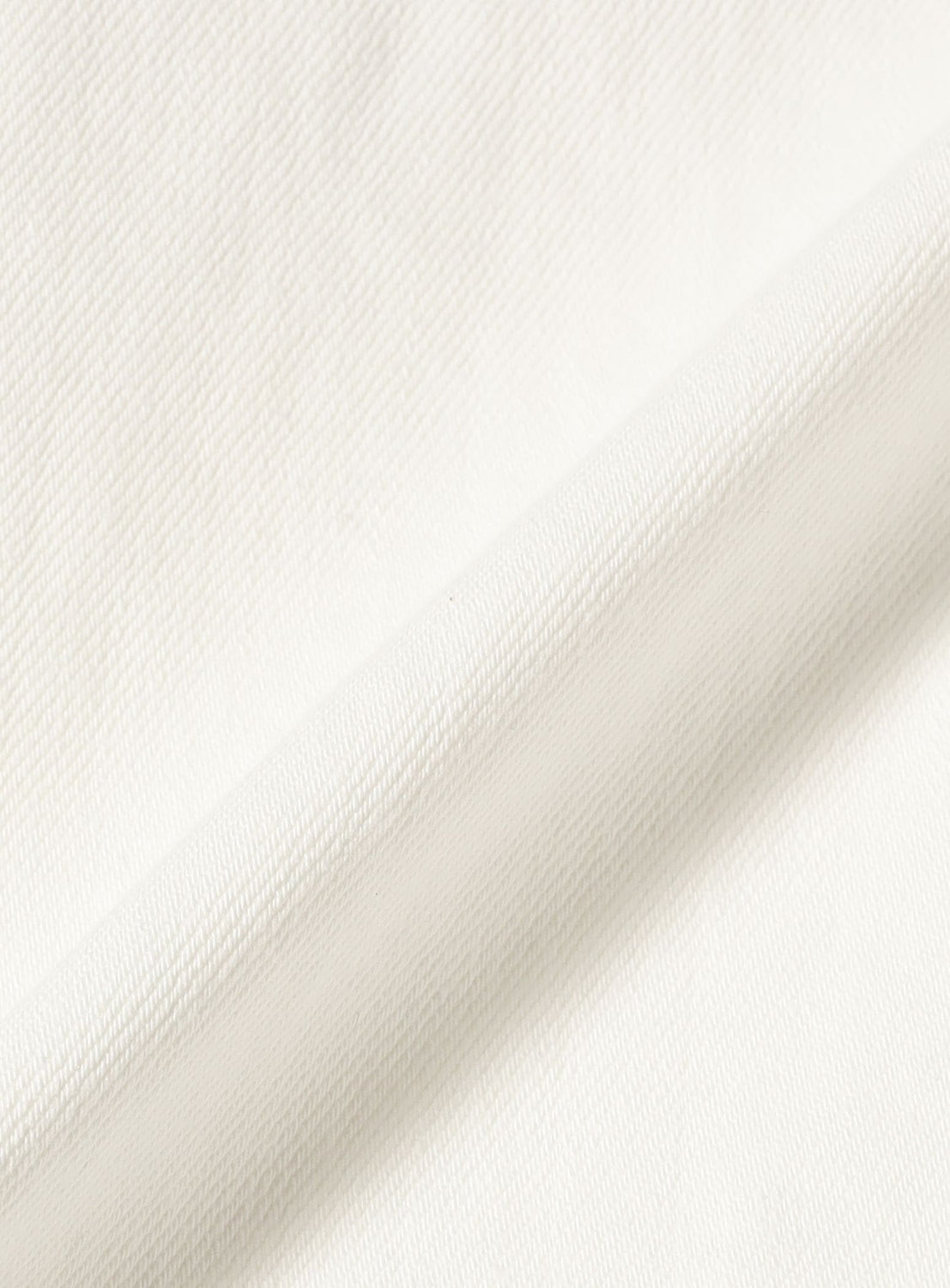 Close-up of BEAMS BOY Straight Fit Wide Denim Pants highlights the textured denim fabric with a subtle diagonal weave and soft feel, featuring a folded crease.