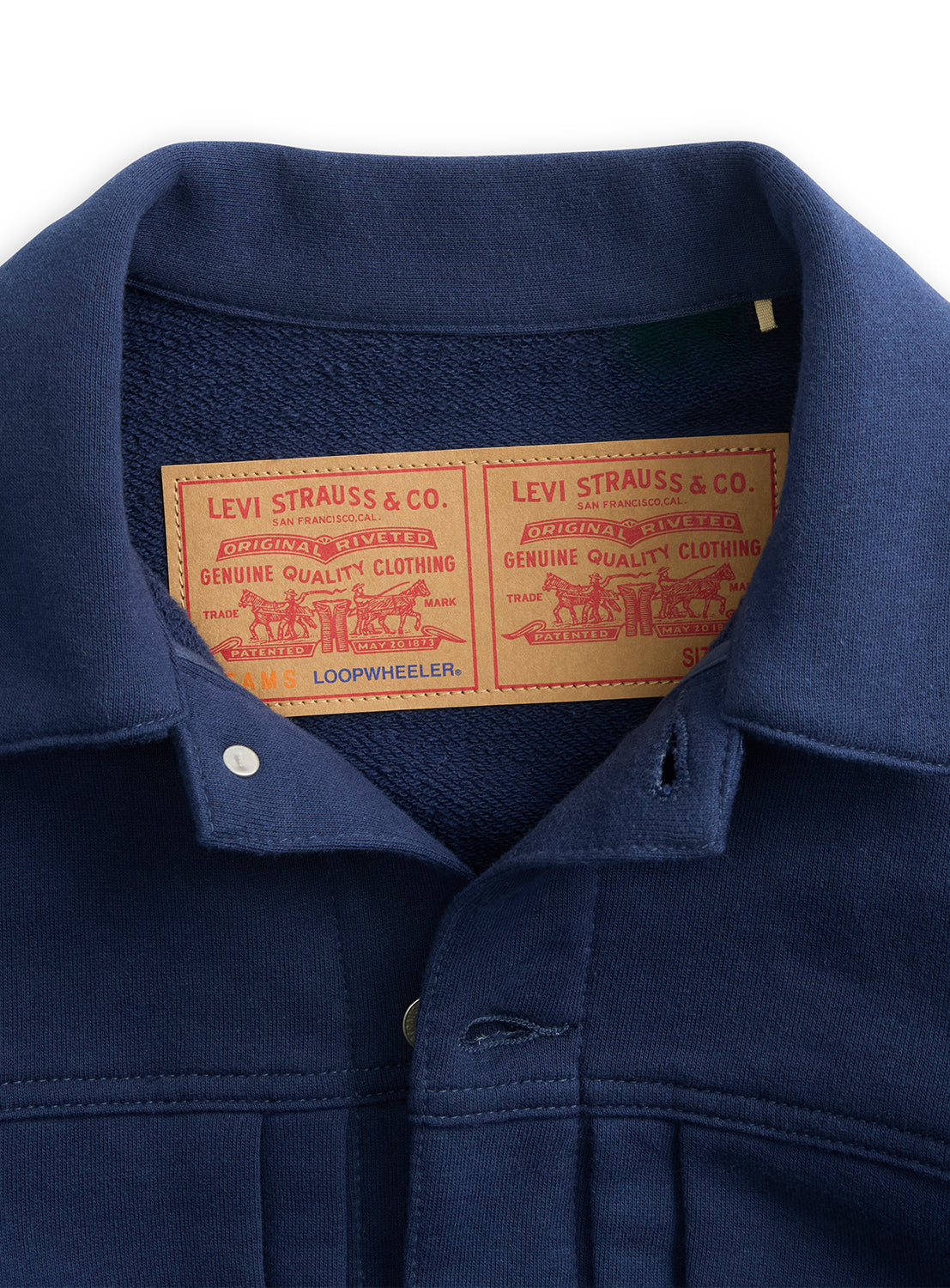 Dark blue Levi’s® x BEAMS x Loopwheeler Superwide Jacket collar with two tan patches.