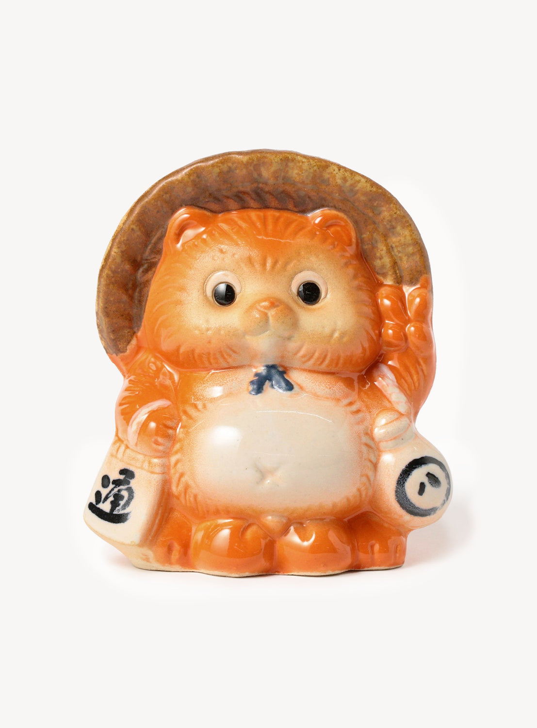 Ceramic figurine of a stylized animal character with a hat on a white background