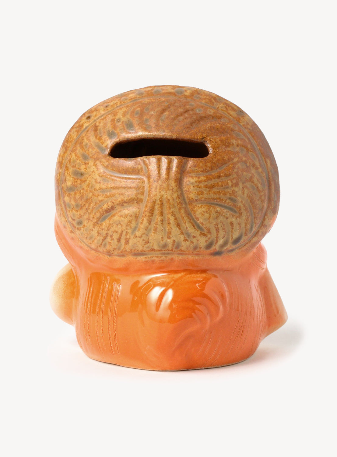 Ceramic tiki mug with a brown top and orange body on a white background