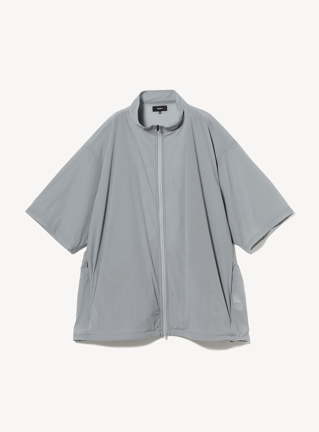 Light-colored full-zip tech shirt with a stand collar and for minimalist styling.
