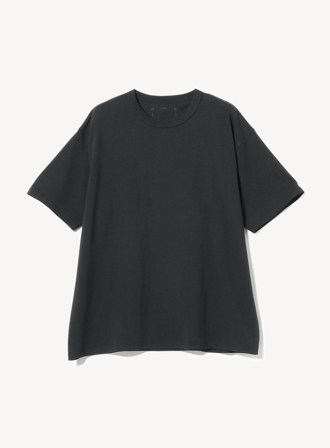 Detailed view of a rich black oversized cotton t-shirt with a classic crew neck, highlighting the fabric texture.