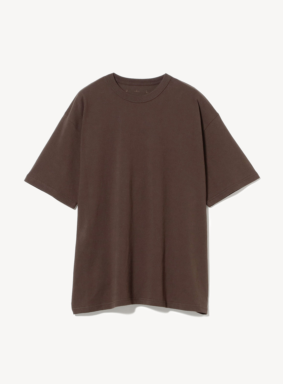 Detailed view of a rich dark brown oversized cotton t-shirt with a classic crew neck, highlighting the fabric texture.