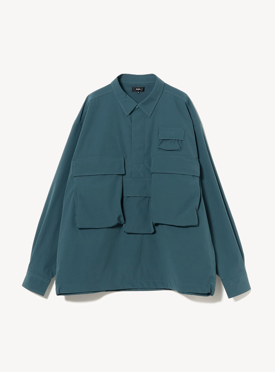 Dark teal long-sleeve shirt with multiple front flap pockets and a half-zip closure.