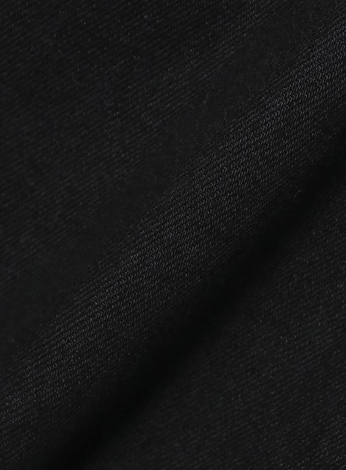 Close-up of the black Japanese denim fabric used in Comfy 5-Pocket Denim, showing its diagonal twill weave.