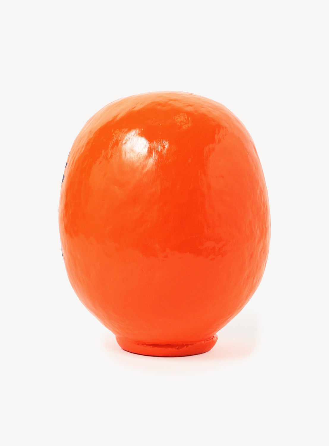 Orange egg-shaped object on a white background