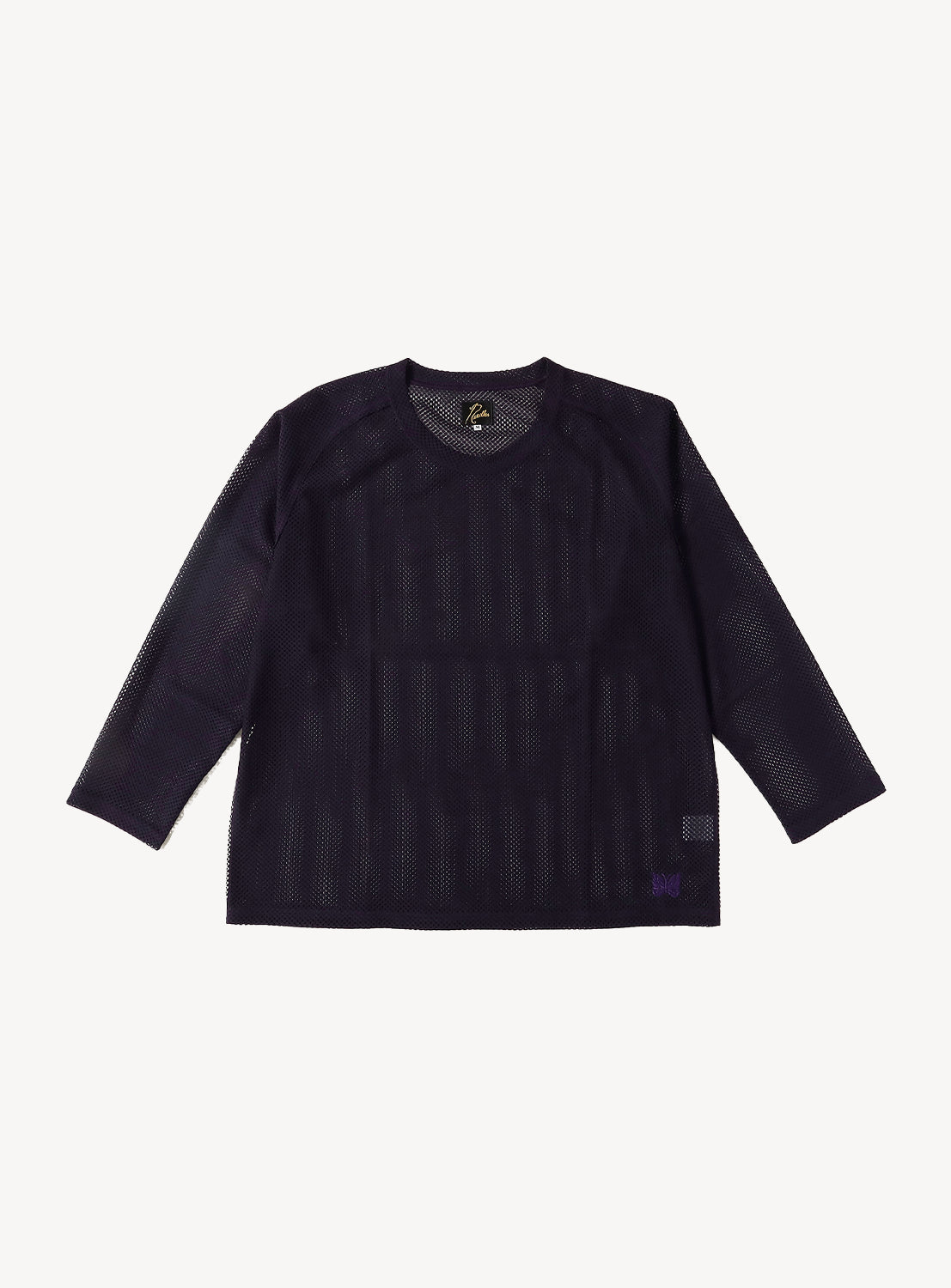 The NEEDLES Long Sleeve Geo Raschel Lace Tee is displayed flat on a white background, showcasing its crew neck and all-over geometric lace pattern in dark purple mesh—making it an ideal sheer layering top.
