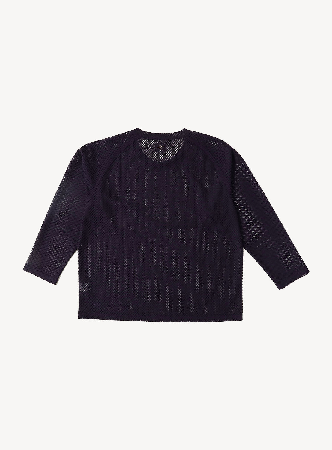 The NEEDLES Long Sleeve Geo Raschel Lace Tee is a black, sheer layering top featuring long sleeves, a round neckline, and see-through mesh fabric, shown laid flat against a white background.