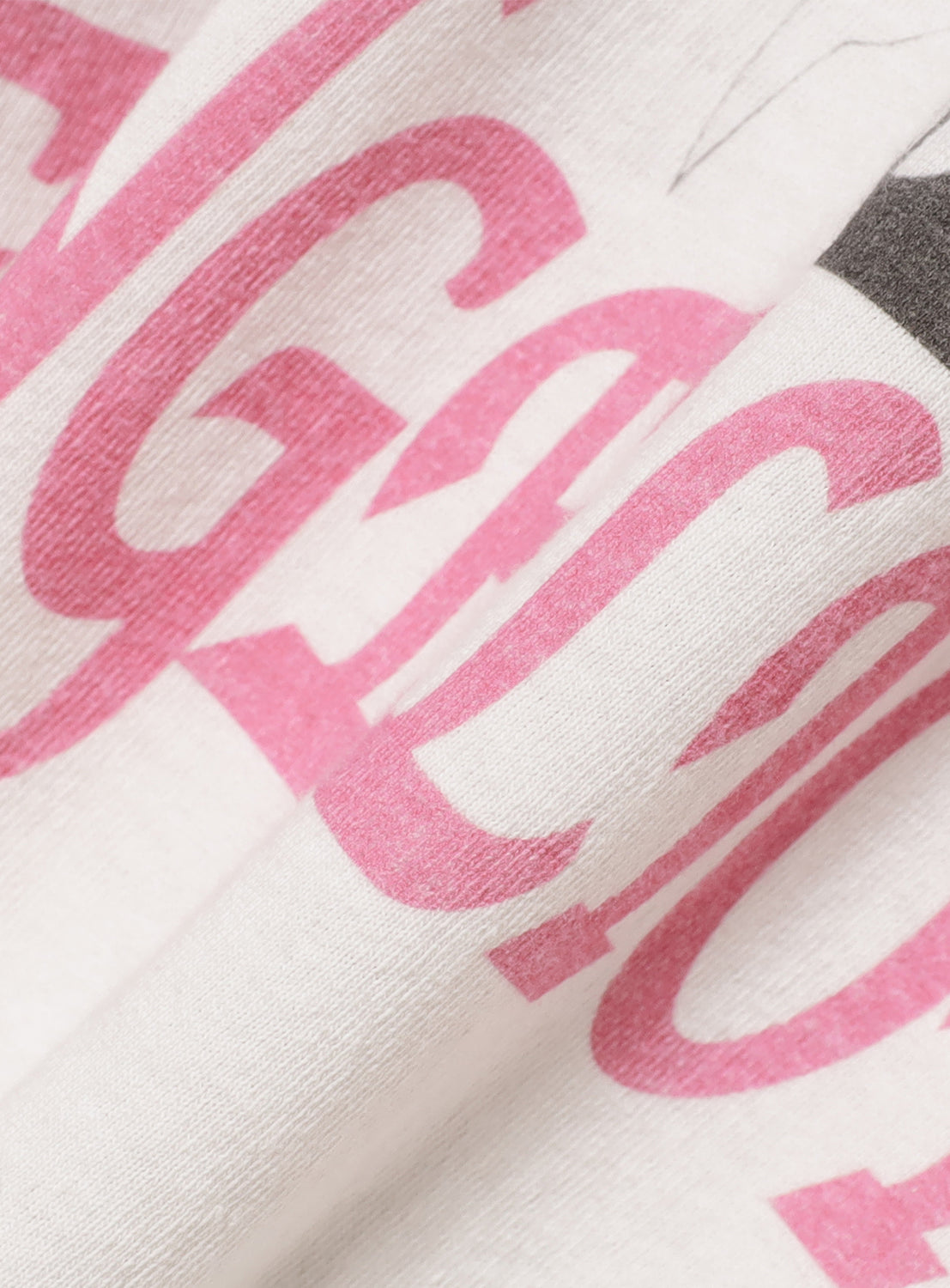 Close-up of the tee's fabric, showing the faded pink "NEON GENESIS" lettering and vintage distressing.