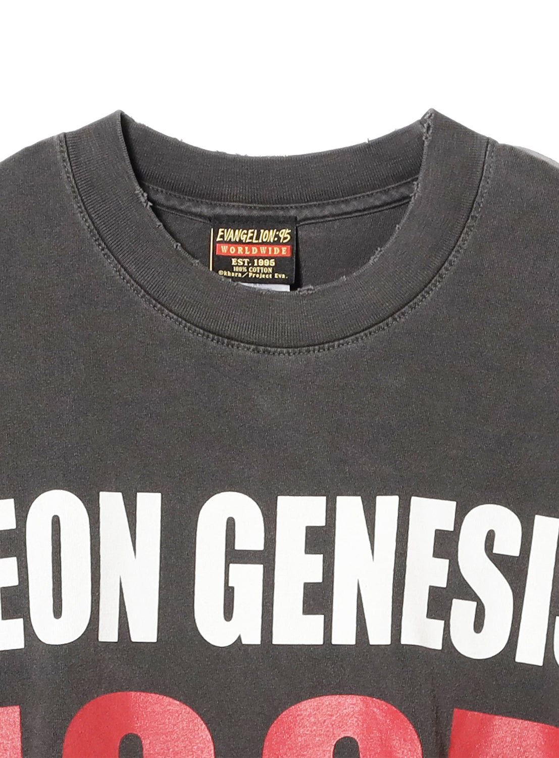Top of the charcoal tee, showcasing the "NEON GENESIS" text and exclusive brand tag.
