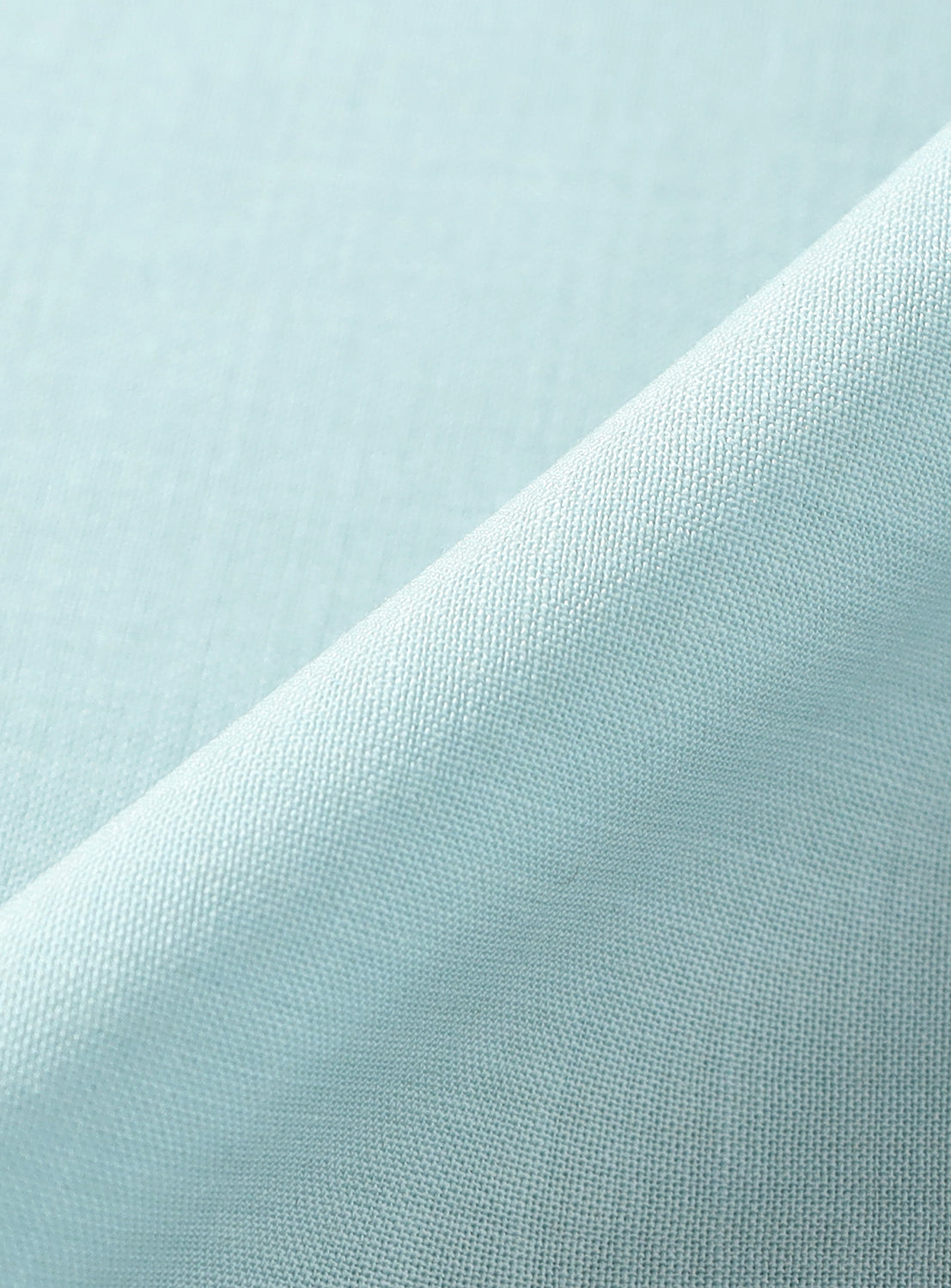 Close-up of light blue fabric texture.