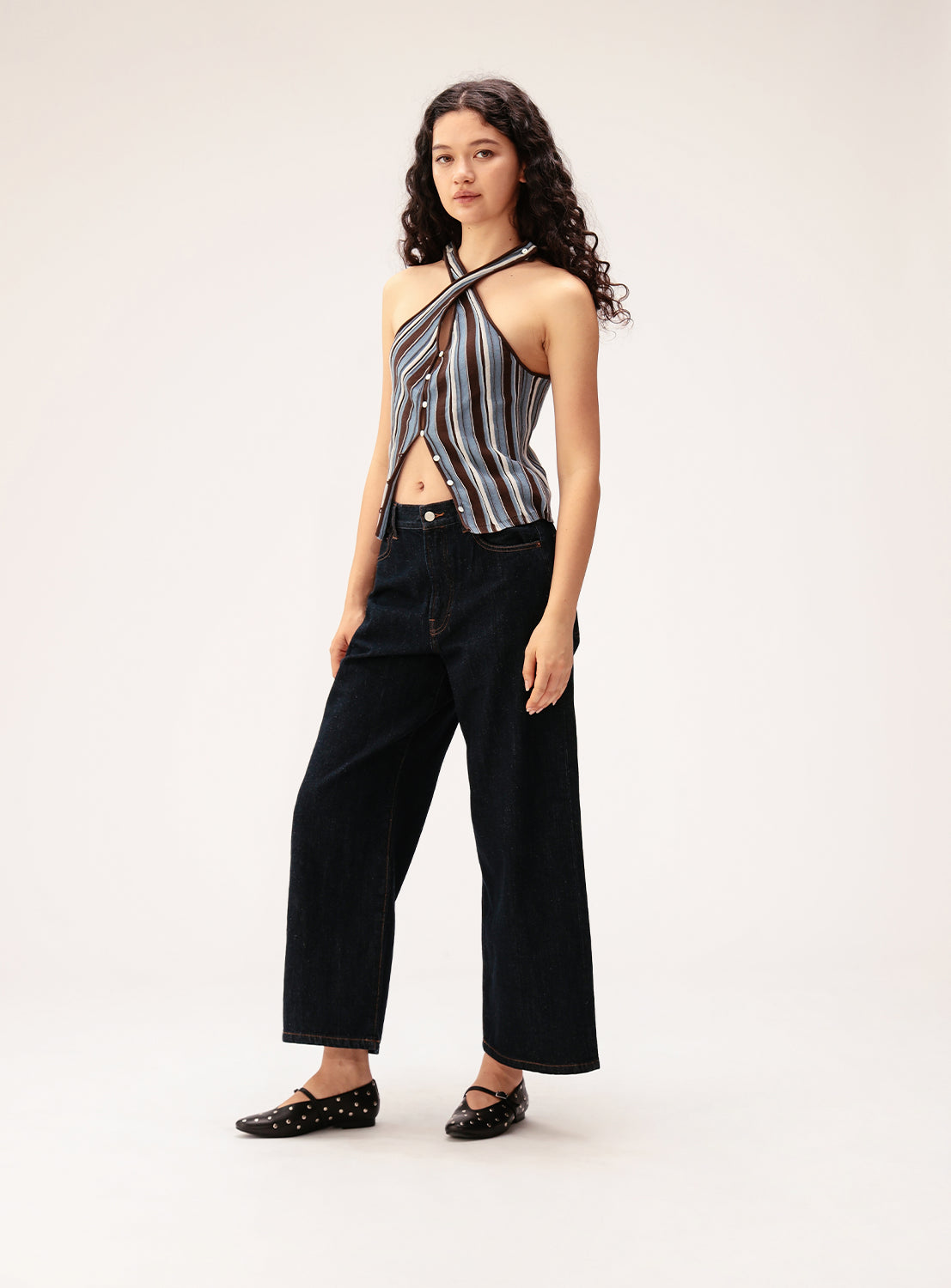 Multi-stripe halter-neck textured knit camisole with button closure.