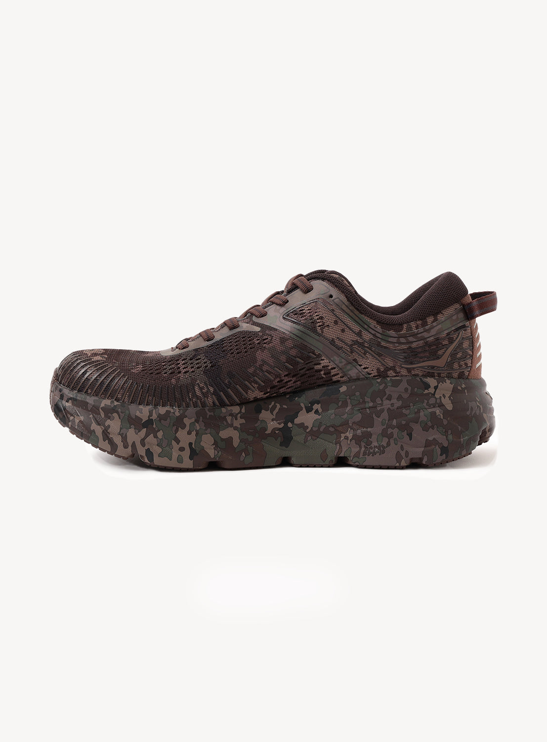 Side view of the brown Hoka U BONDI 7 BEAMS sneaker, featuring a camouflage pattern on both the upper and sole, engineered mesh upper for enhanced breathability and lightweight cushioning, designed for outdoor use, shown against a plain white background.