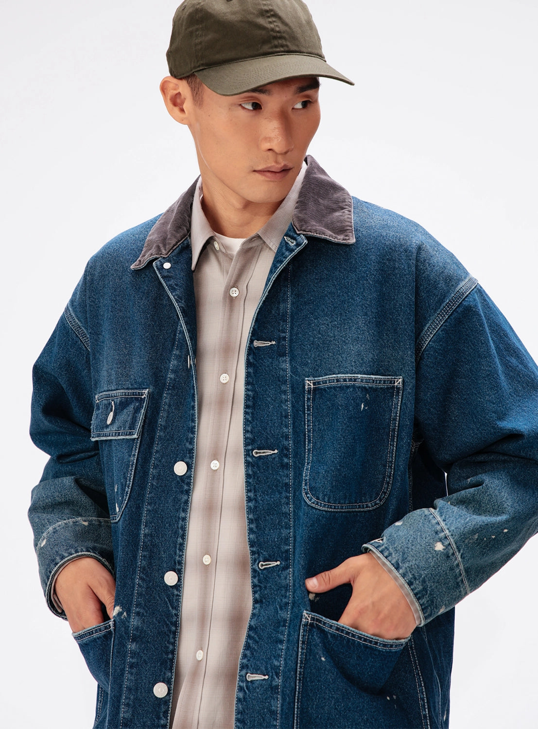 BEAMS Used Denim Coverall with grey corduroy collar, chest pockets, and paint splatters.