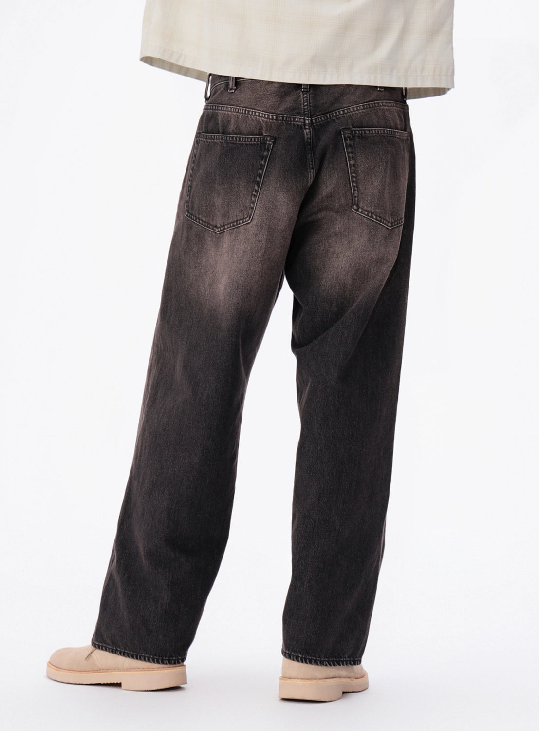 Back view of BEAMS Wide Fit Denim Pants in a faded wash with two back pockets.