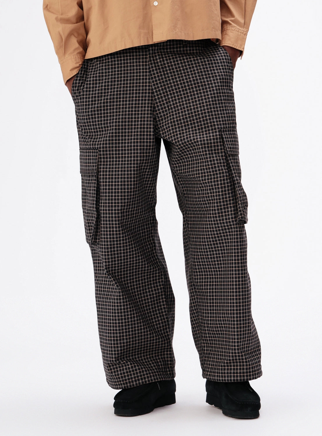 BEAMS Pattern 6-Pocket Pants in a relaxed-fit plaid with six pockets and adjustable hems, worn with a tan button-down shirt and black shoes.