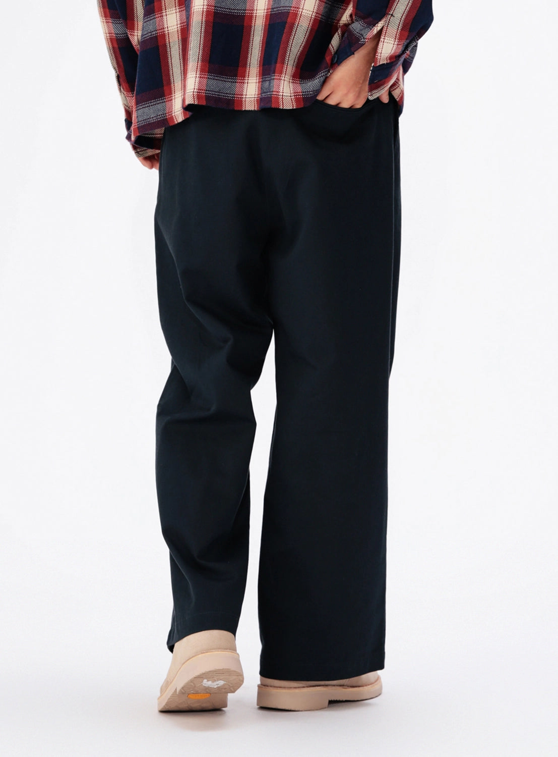 Back view of black BEAMS New Wide Chino Pants featuring a single back pocket.