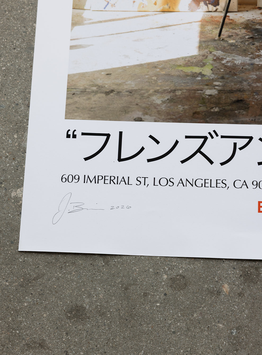 A close-up of the J. BRIAN x BEAMS POSTER 2 by BEAMS AMERICA on concrete, featuring Japanese text, a Los Angeles address, original artwork, a signature, and the year "2020" in the lower left corner.