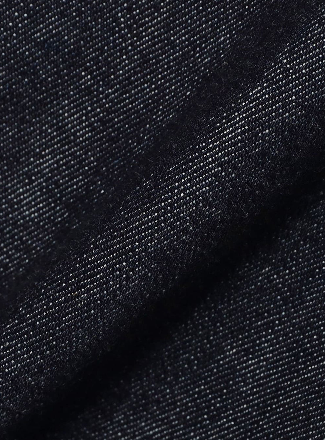 Close-up of dark indigo BEAMS Comfy 5-Pocket Denim with a visible twill weave.