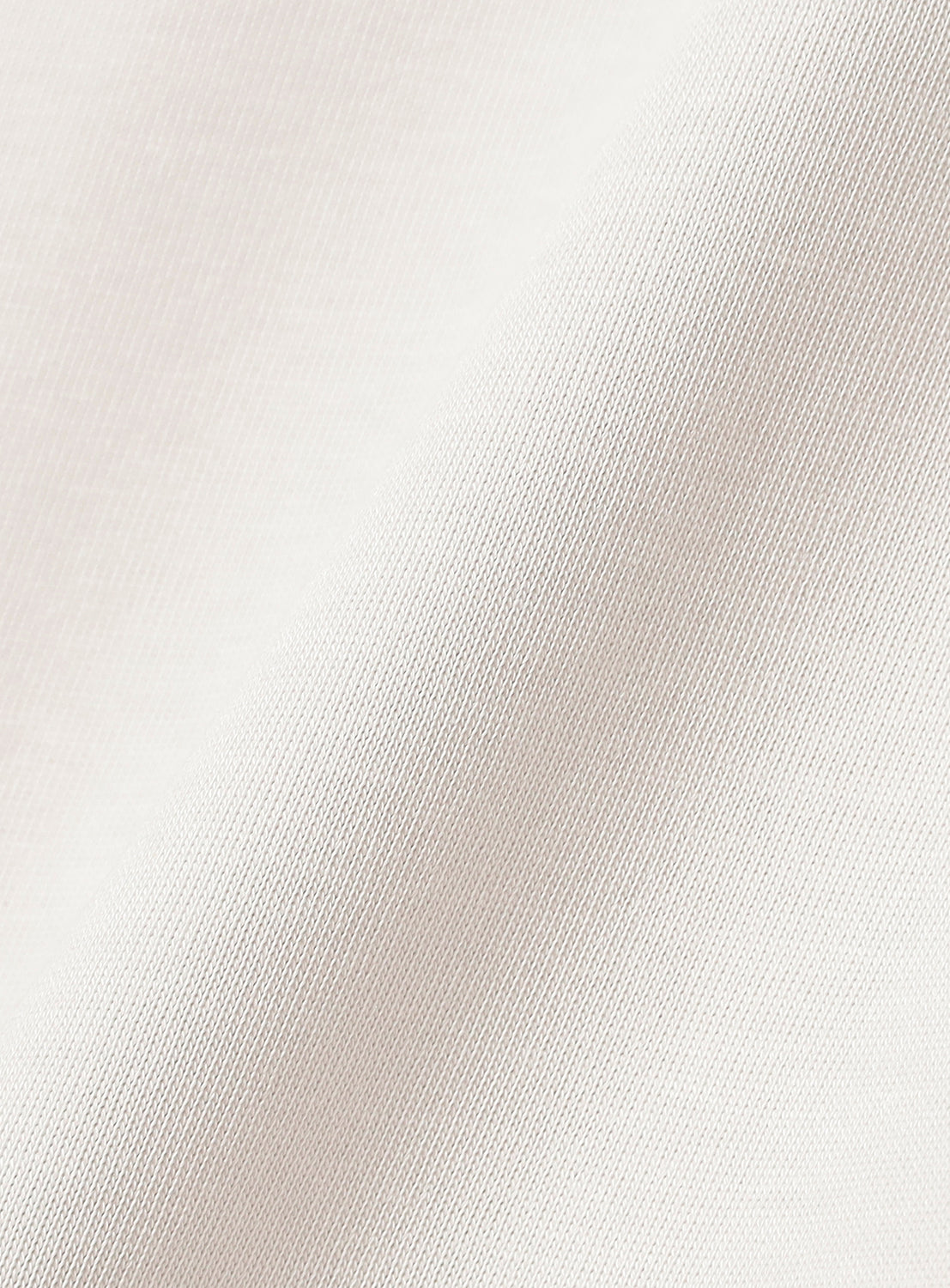 Close-up of a textured white fabric surface