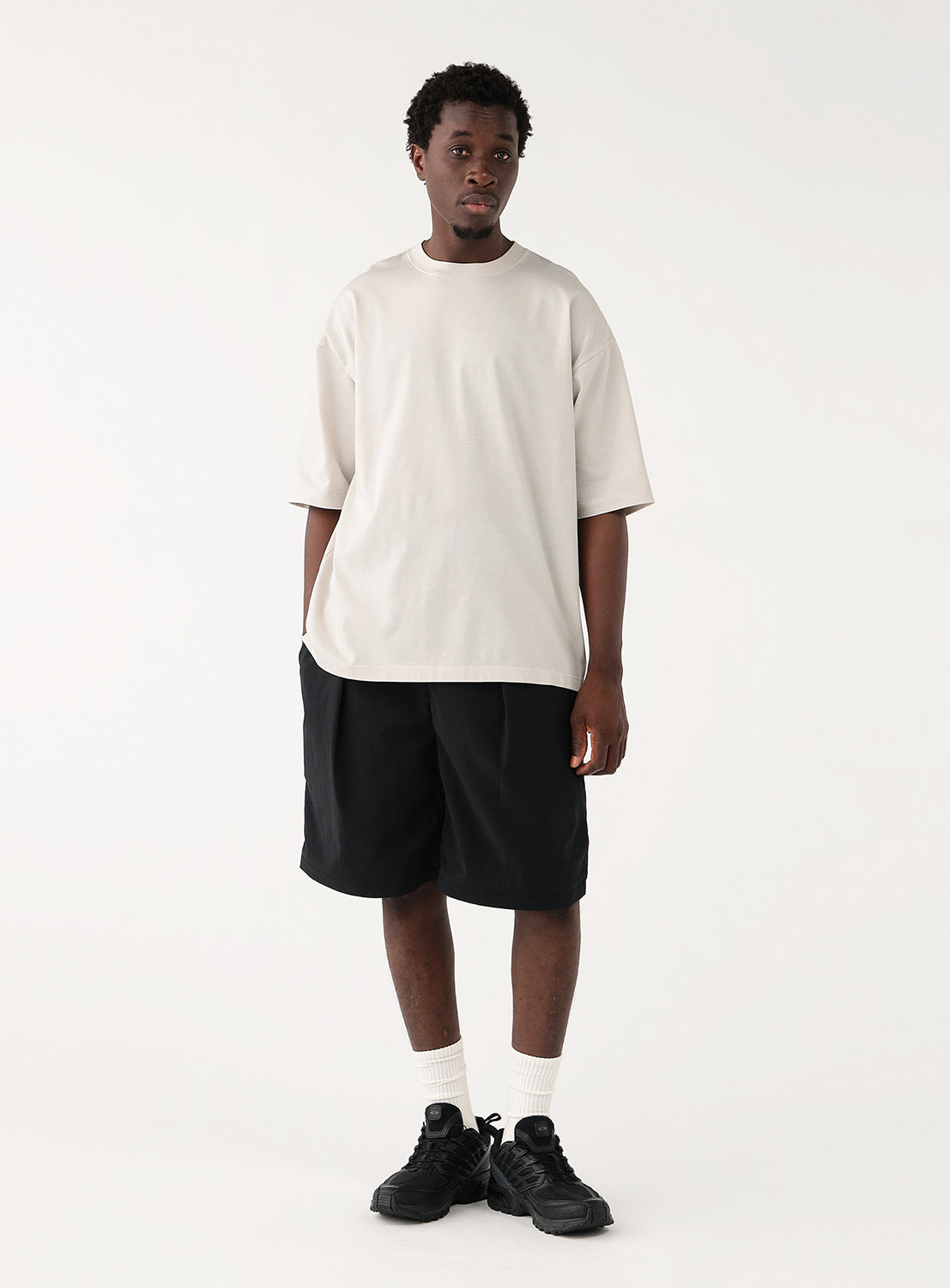 Styled model wearing oyster colored t-shirt 