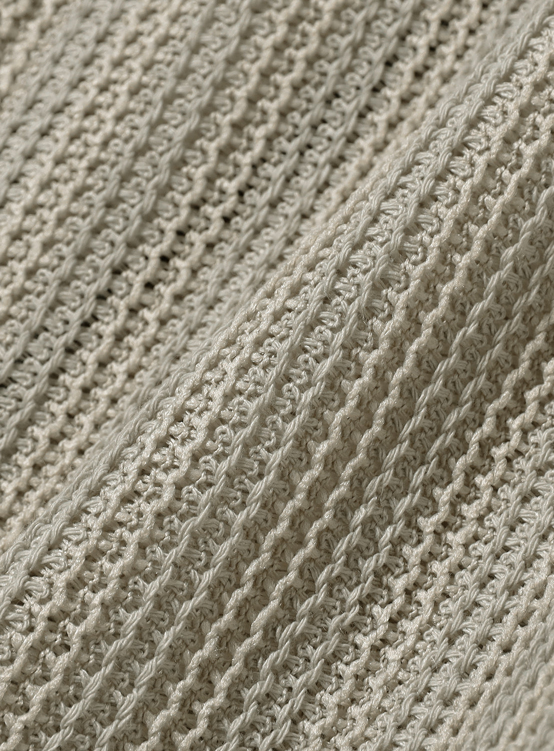Close-up of mesh hoodie fabric.