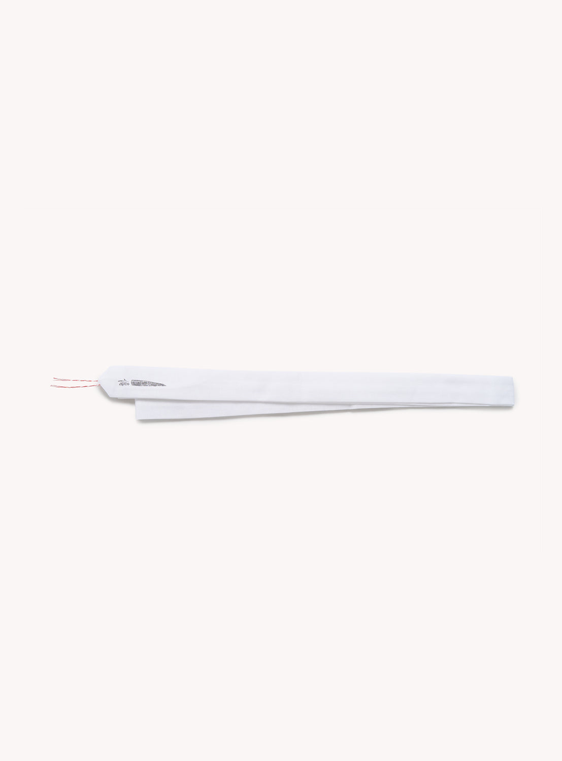 A single, long, white chopstick wrapper with red text and two red strings extending from one end, displayed on a plain light background—evoking the clean lines and simplicity characteristic of Tutaee Men’s Yukata by Tutaee, inspired by the traditional Japanese garment.