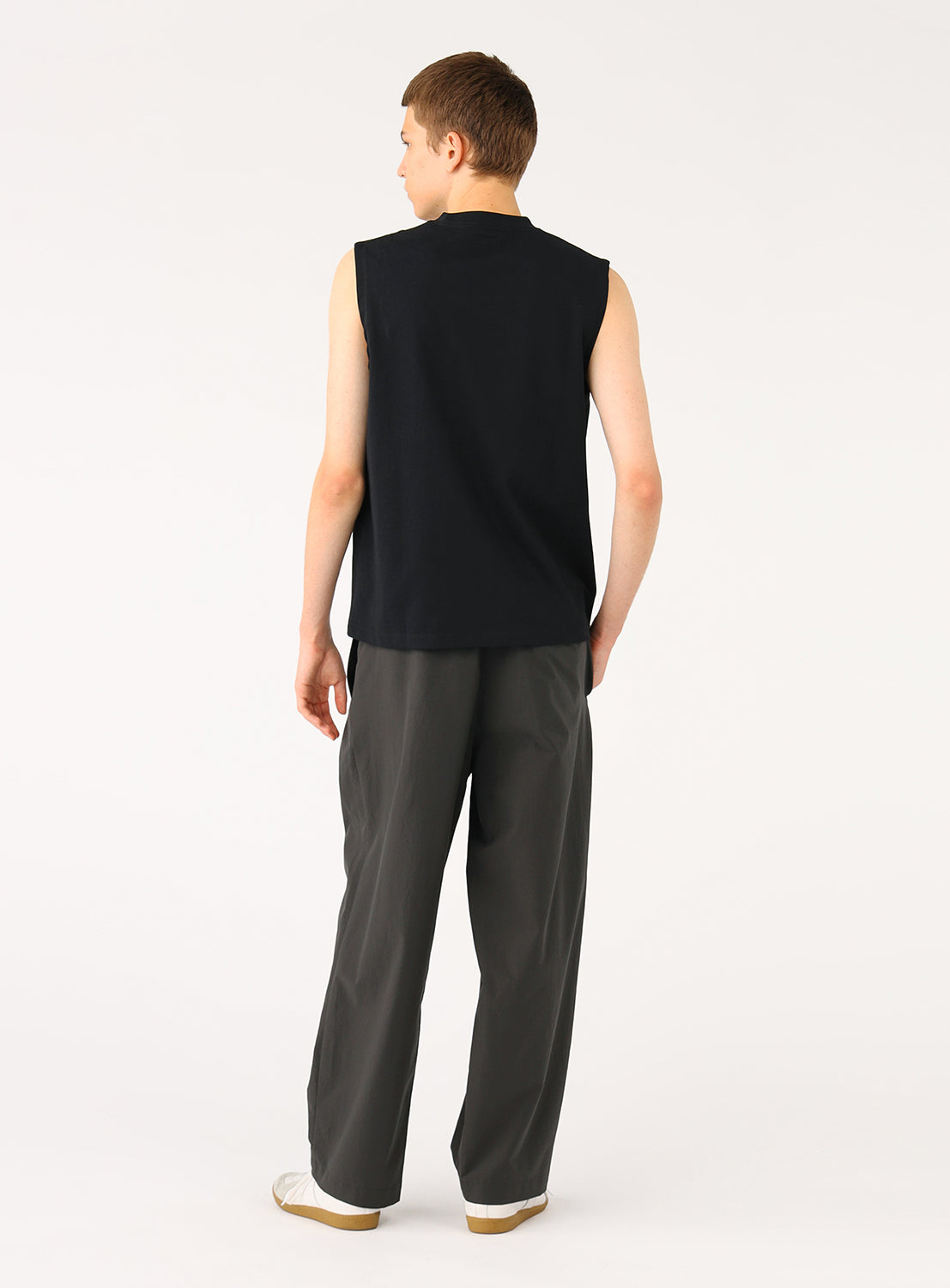 Back view of a model in the black sleeveless top