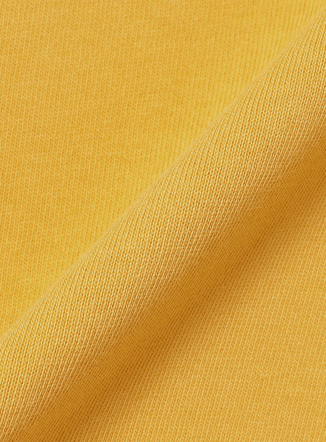 Macro shot of the yellow fabric, revealing a soft, textured weave.
