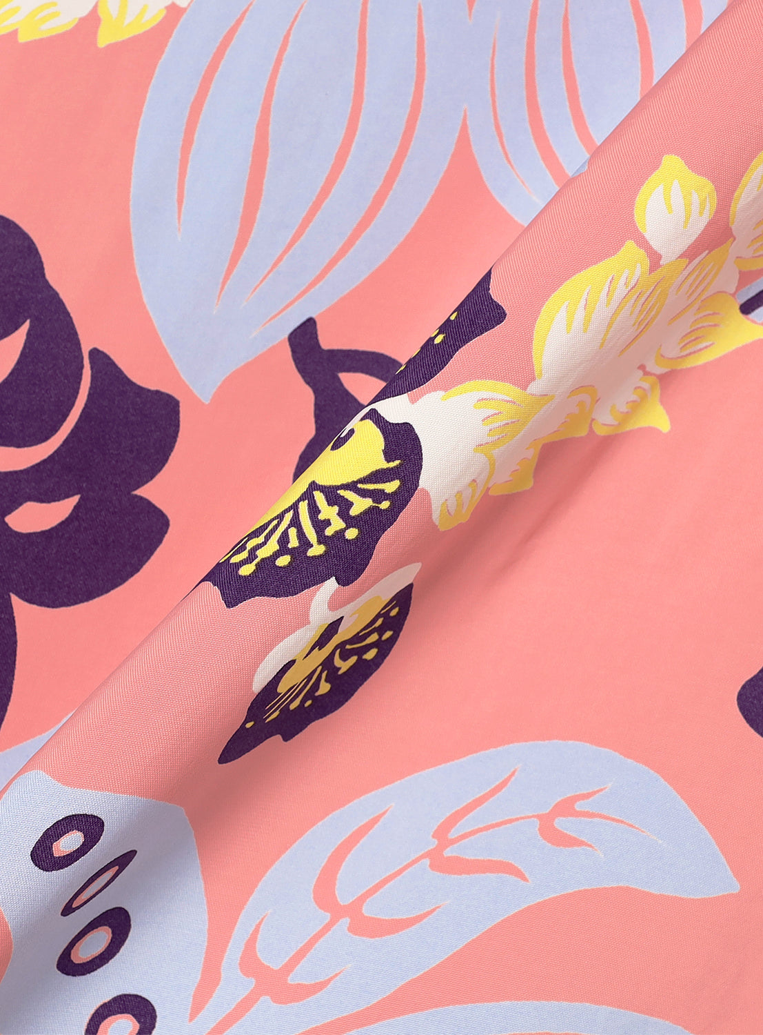 pink patterned fabric, revealing the colorful abstract print in detail.