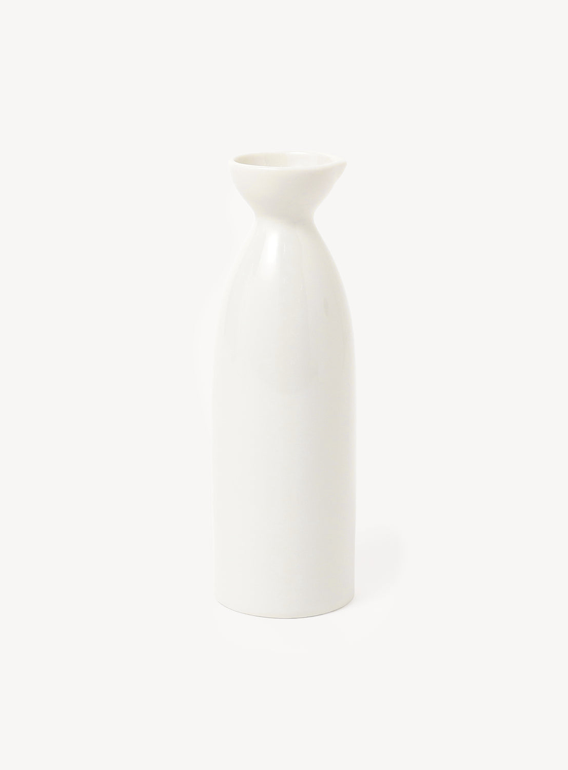 White ceramic sake bottle on a light beige background